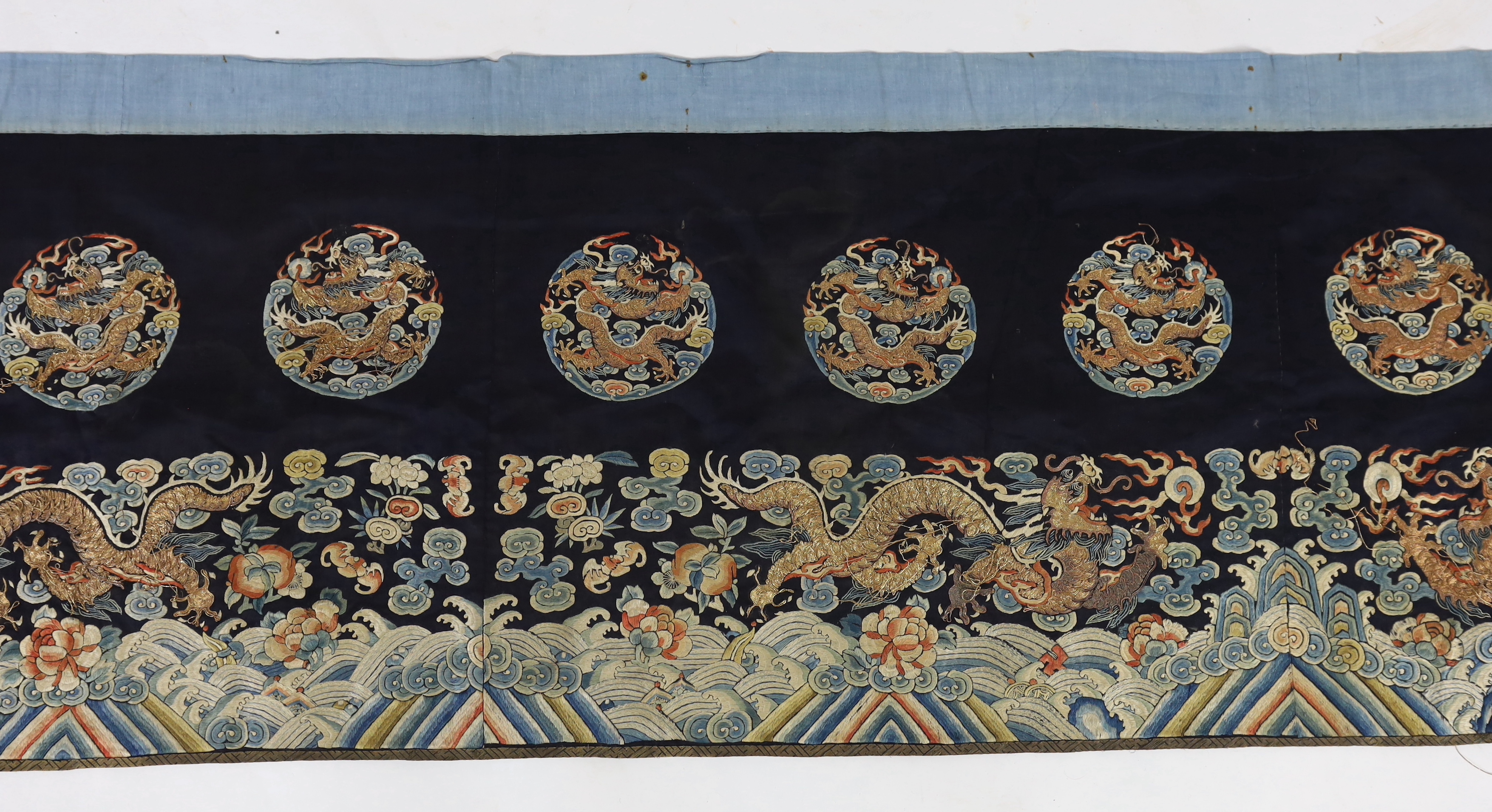 A Chinese embroidered silk 'dragon' table frontal, 19th century, damage